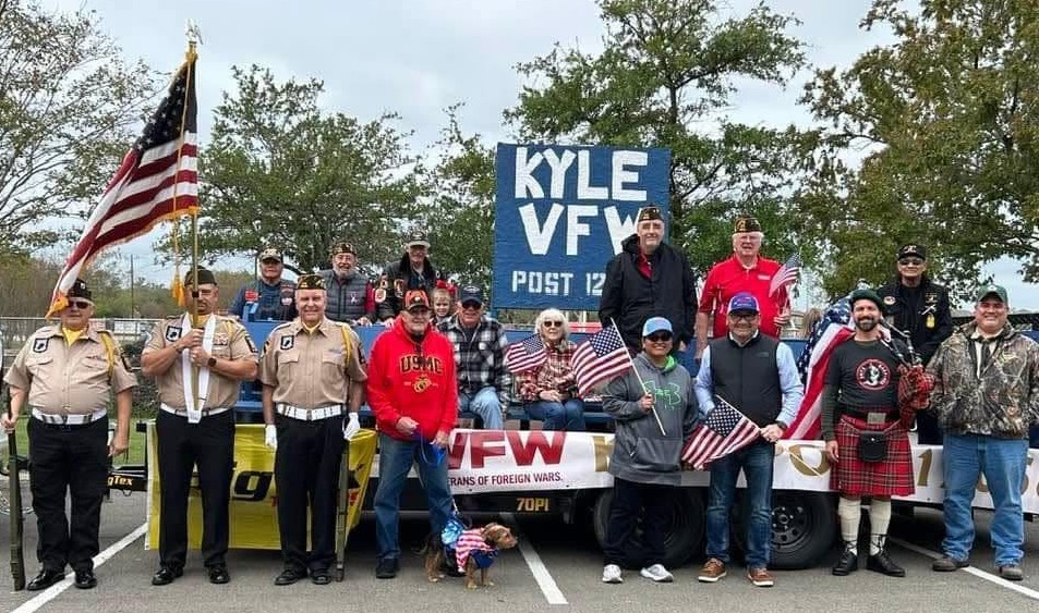 Robert Rizo and his wife with veterans at a parade